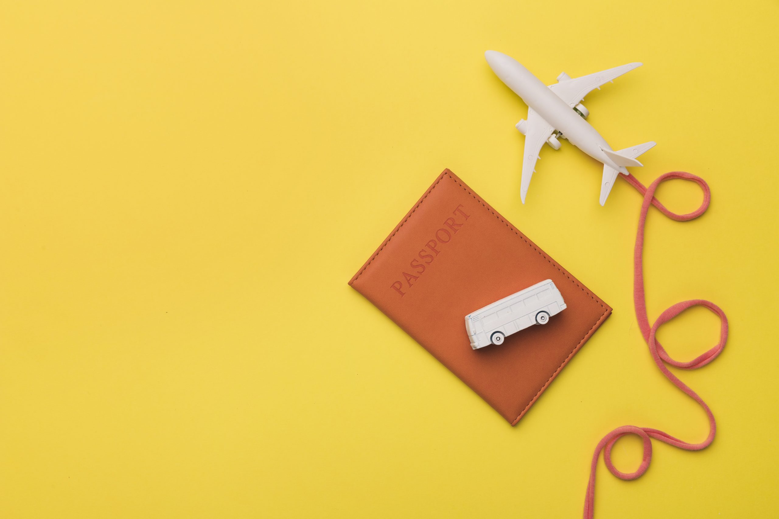 composition-toy-jet-with-airline-passport-bus